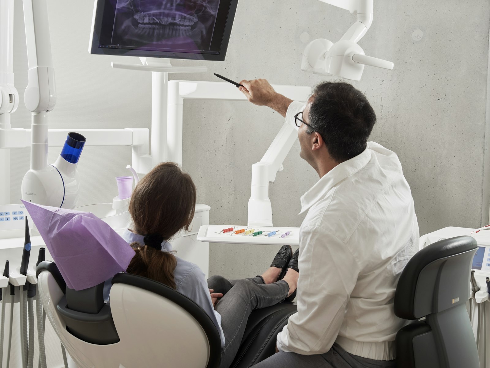 Dentist and patient reviewing imaging together